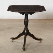 A REGENCY EBONIZED DROP LEAF T