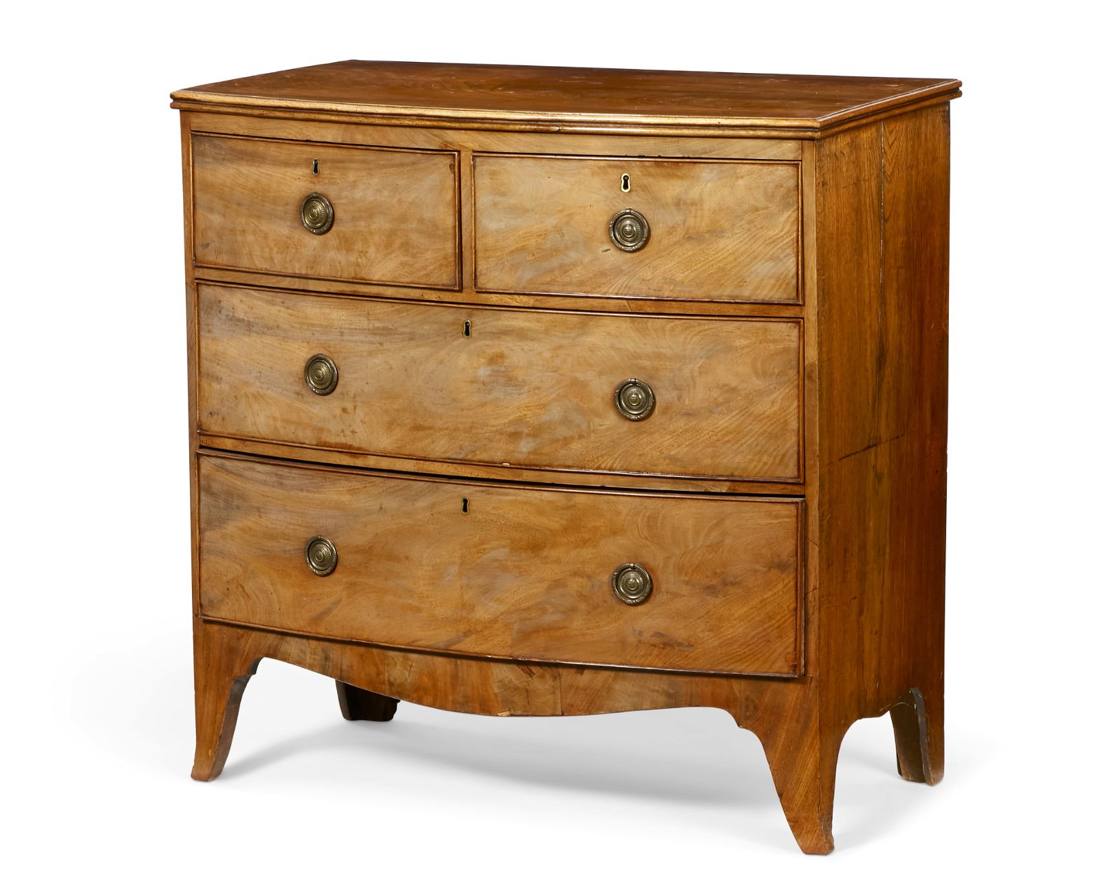 A REGENCY MAHOGANY BOW FRONT CHESTA
