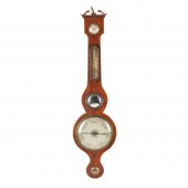 A REGENCY MAHOGANY WHEEL BAROM