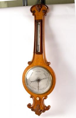 A Regency oak wheel barometer