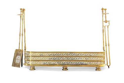 A REGENCY PIERCED BRASS FIRE FENDER