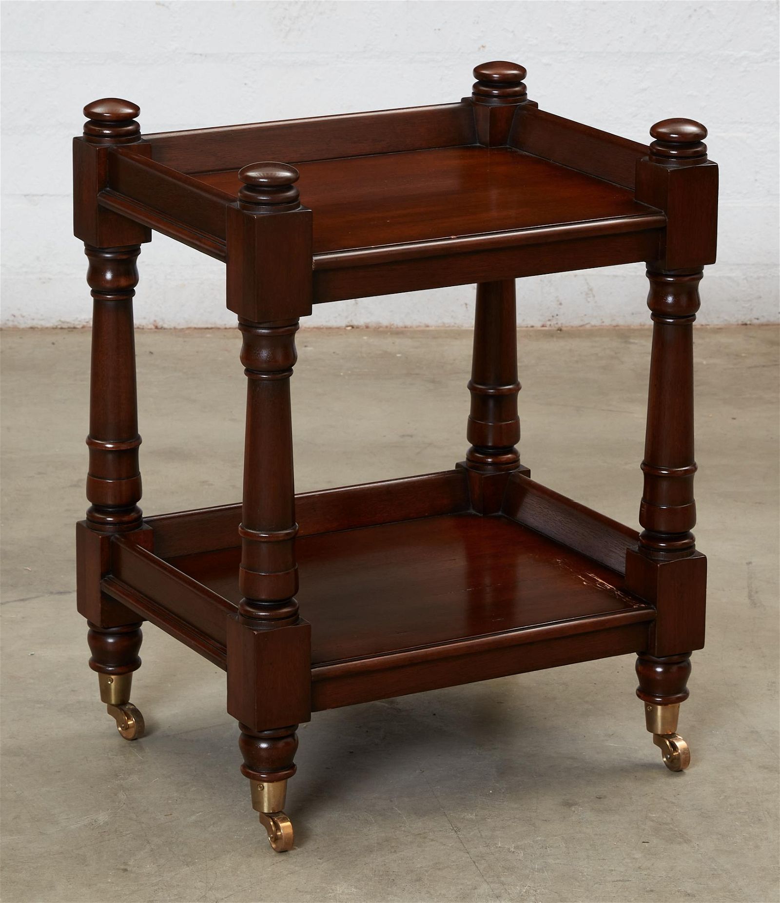 A REGENCY STYLE MAHOGANY TWO TIER