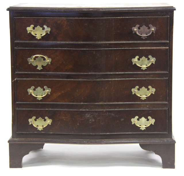 A reproduction serpentine chest
