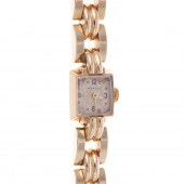 A RETRO 14K YELLOW GOLD MOVADO