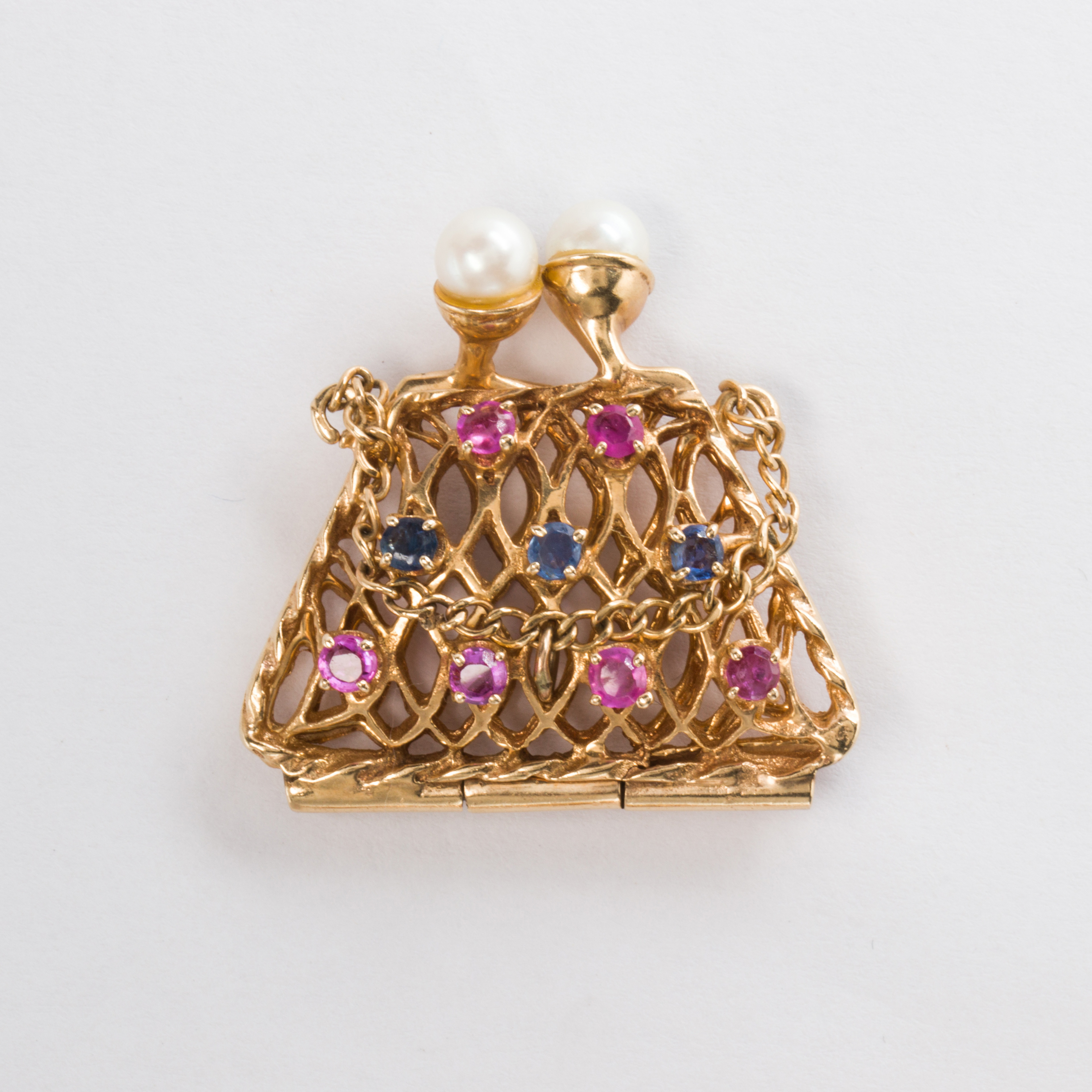 A RETRO GEMSTONE AND FOURTEEN KARAT