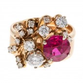 A RETRO RUBY & DIAMOND RING IN