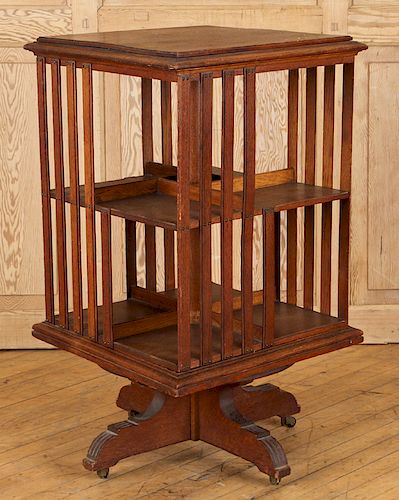 A REVOLVING OAK BOOKCASEA revolving