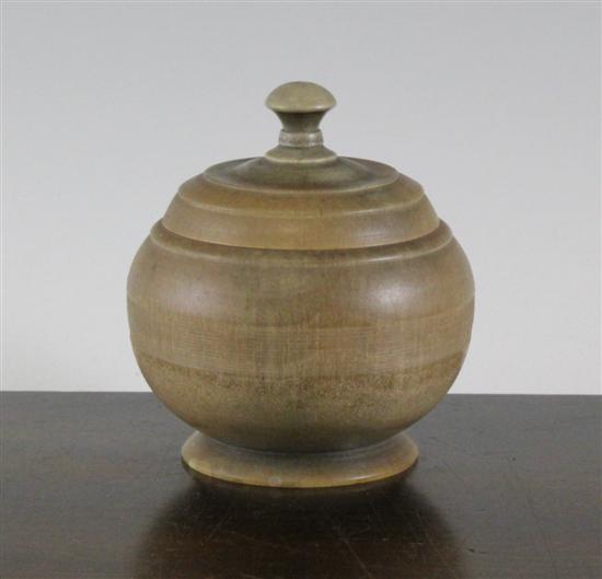 A rhinoceros horn jar and cover