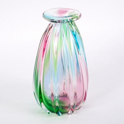 A ribbed studio glass vase in