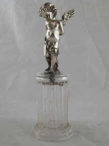 A rock crystal column with a silver