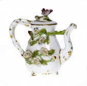 A ROCKINGHAM FLORAL ENCRUSTED