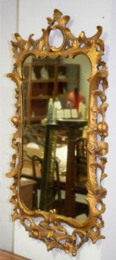 A Rococo style giltwood and ge