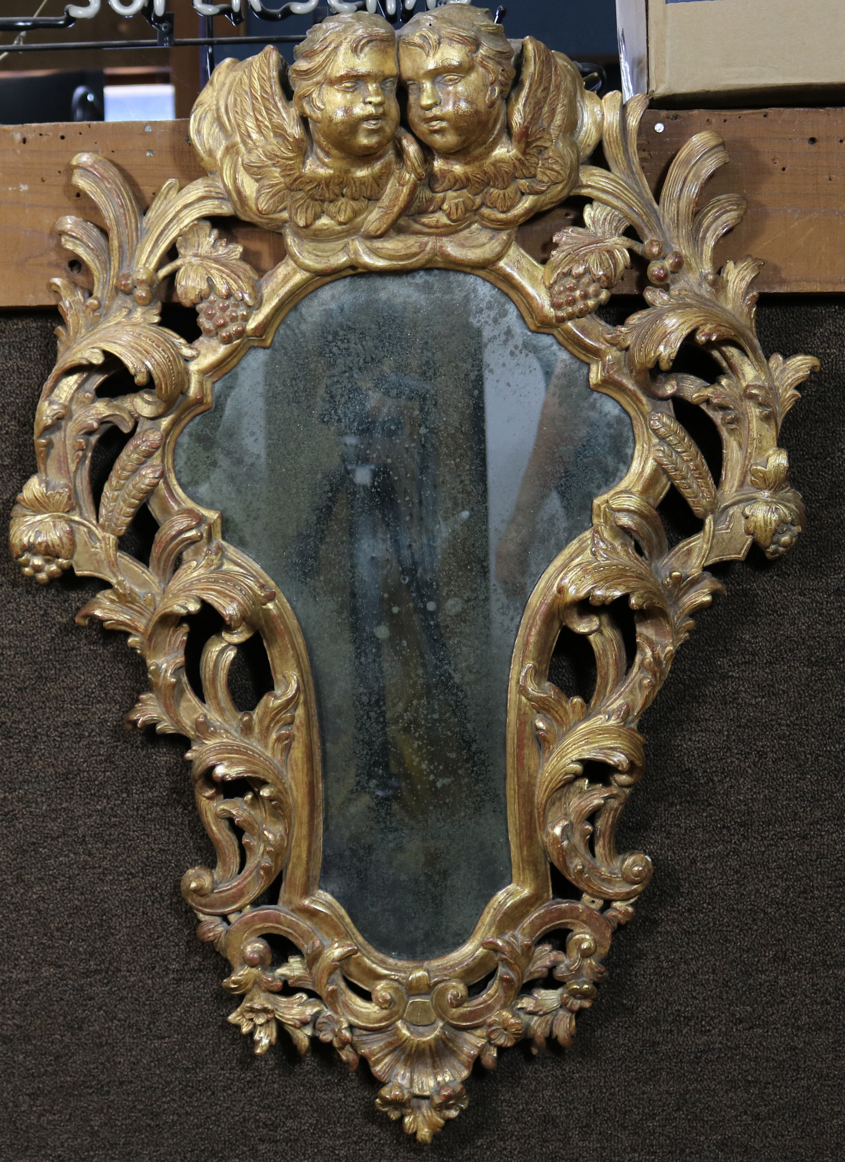 A ROCOCO STYLE GILTWOOD MIRROR A