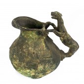 A ROMAN BRONZE ASKOS WINE JUG,