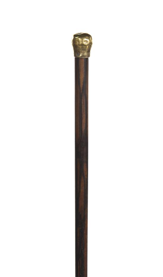A Rosewood and 18 Karat Yellow Gold