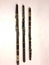 A rosewood flute with another