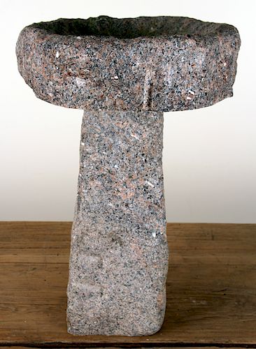 A ROUGHHEWN MODERN GRANITE BIRD