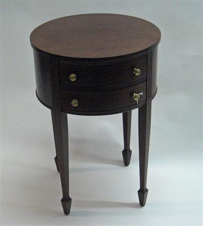 A ROUND 2 DRAWER TABLE  late 20th