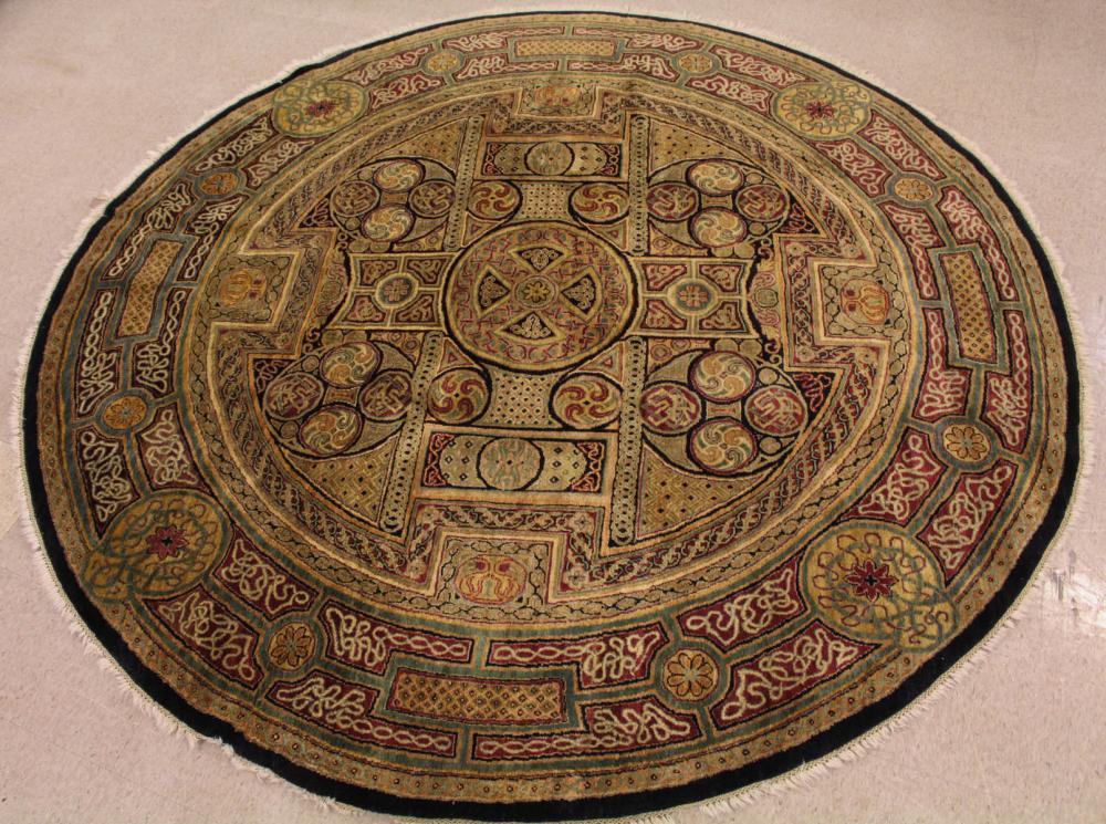 A ROUND HAND KNOTTED ORIENTAL