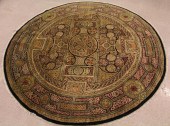 A ROUND HAND KNOTTED ORIENTAL