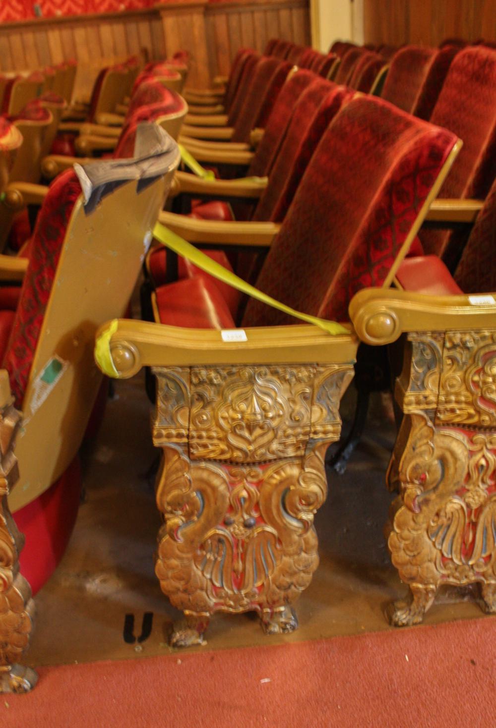 A ROW OF TEN VINTAGE THEATER SEATSA