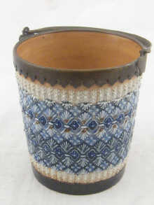 A Royal Doulton plant holder in the