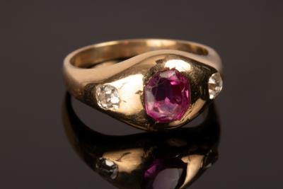 A ruby and diamond three-stone ring