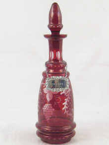 A ruby flashed glass decanter facet
