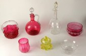 A ruby tinted glass carafe wit