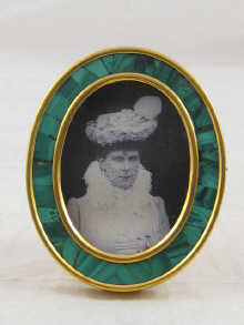 A Russian brass photo frame with