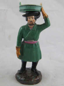A Russian ceramic figure of a