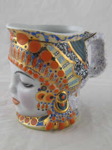 A Russian ceramic tankard formed