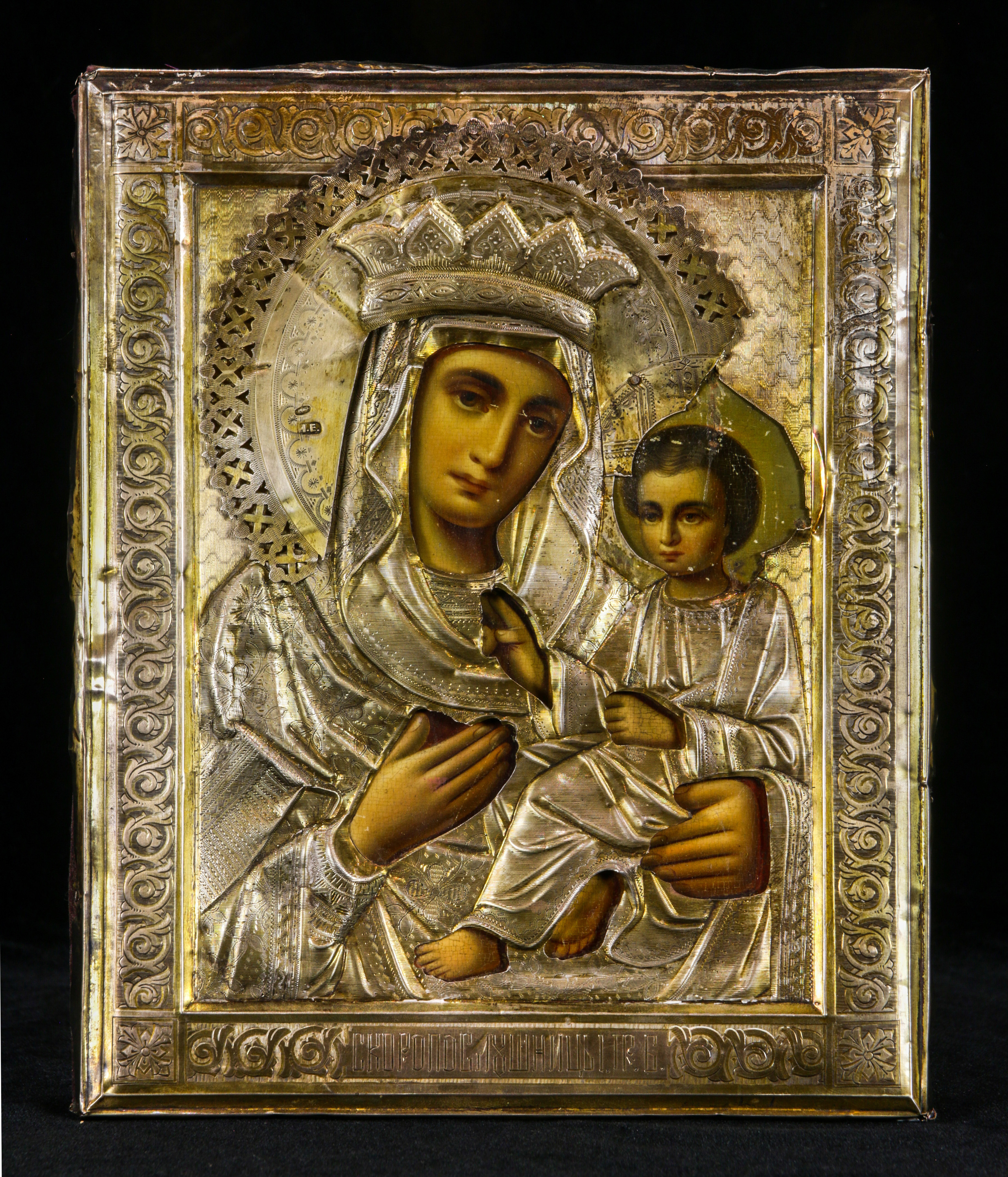 A RUSSIAN SILVER GILT OKLAD ICON