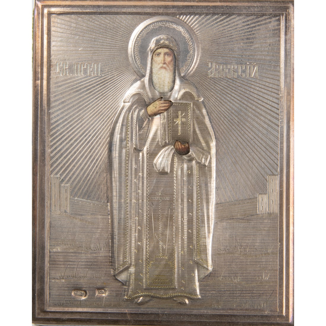 A RUSSIAN SILVER OKLAD ICON OF