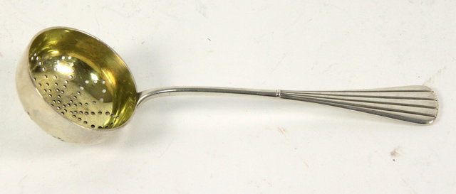 A Russian silver tea strainer
