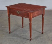 A RUSTIC AMERICAN BROWN PAINTE