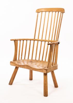 A rustic stick back chair with a