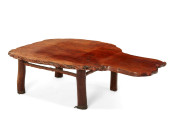 A RUSTIC WALNUT BURLWOOD TABLE