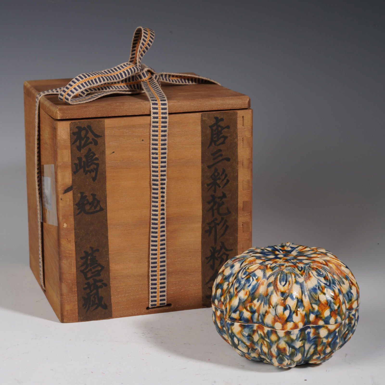 A SANCAI PORCELAIN MELON SHAPED