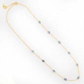 A SAPPHIRE AND EIGHTEEN KARAT