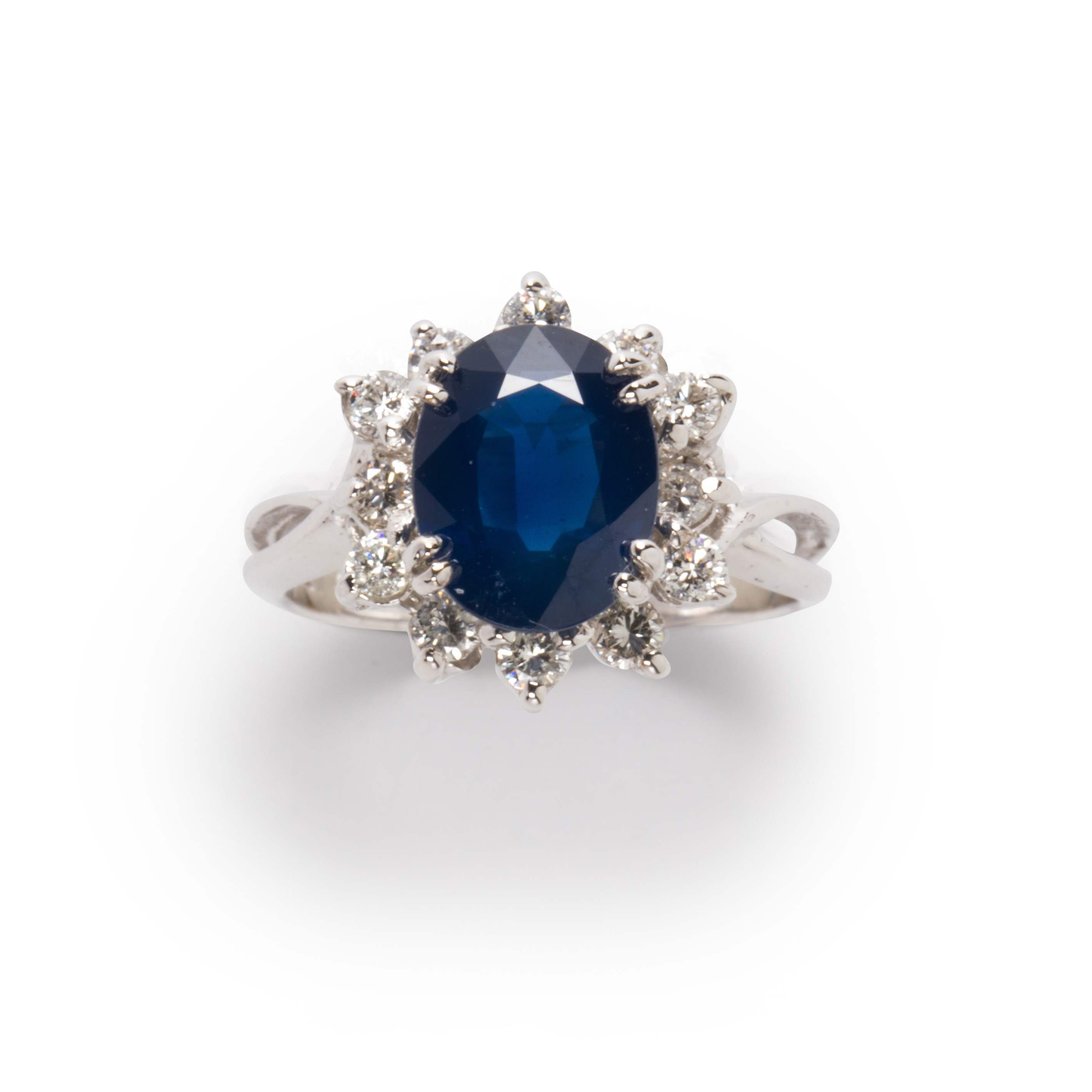 A SAPPHIRE, DIAMOND AND FOURTEEN