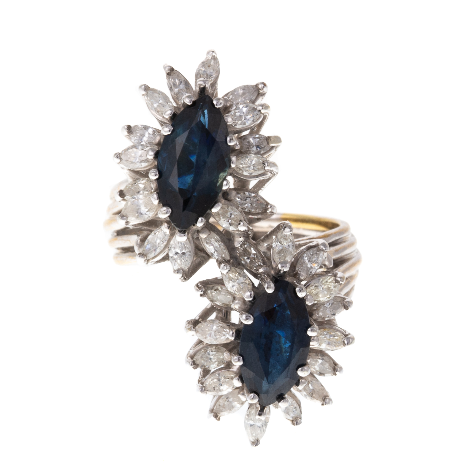 A SAPPHIRE & DIAMOND BYPASS RING IN