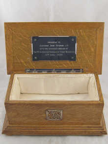 A satin lined oak freedom casket 35