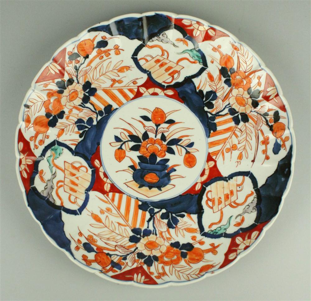 A SCALLOPED IMARI DISH decorated in