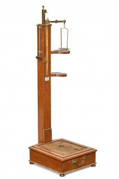 A SCOTTISH OAK AND BRASS MOUNT