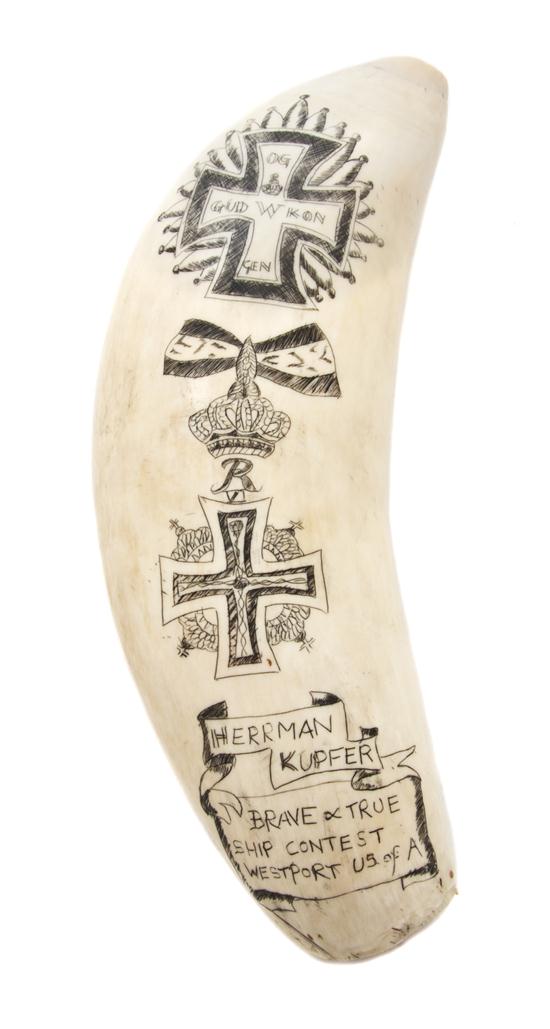 A Scrimshaw Whale's Tooth one