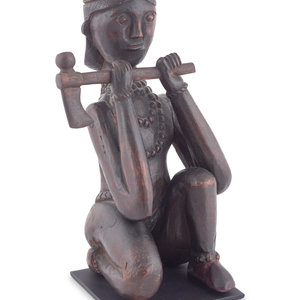 A Seated Folk Art Carved Walnut
