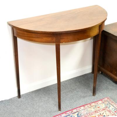 A semi-elliptical side table, circa
