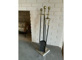 A set of brass fireplace tool