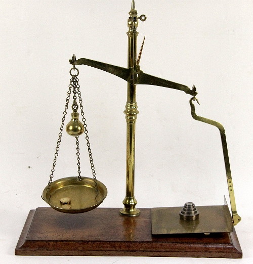 A set of brass parcel scales on a